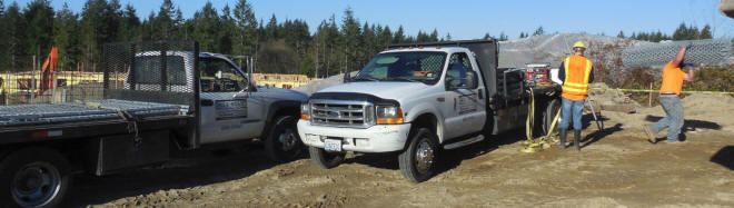 Unloading tempoary fencing materials on a construction site in Tacoma