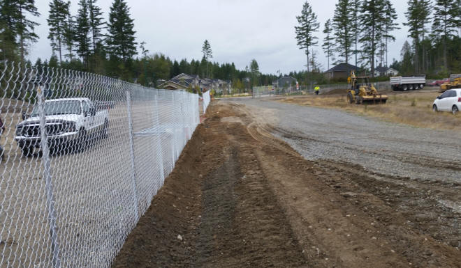 Driven post temporary fencing for a retirement community construction project.