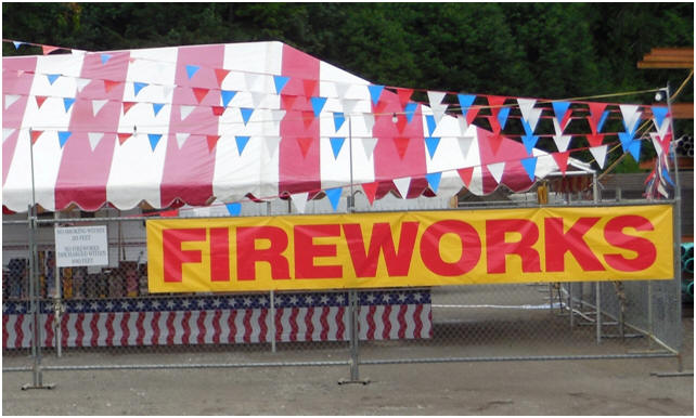 Rental fencing around a fireworks stand on the Fourth of July