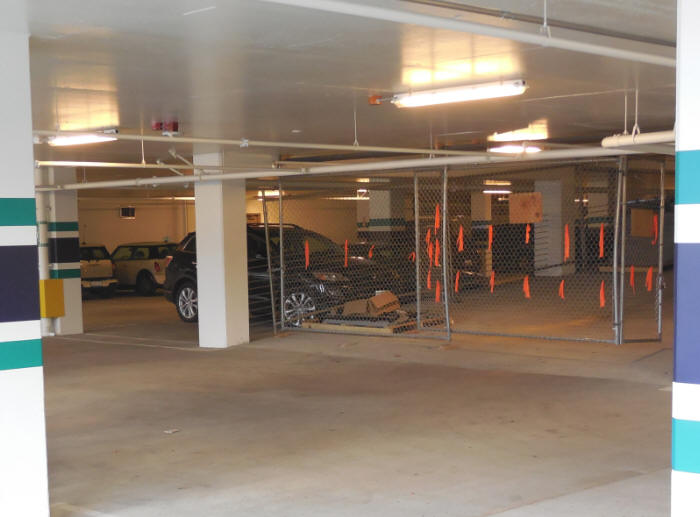 Temporary fencing in the Seahawks stadium parking garage - custom built for drive ramp