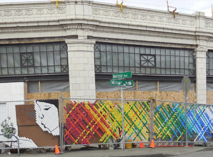 Artwork decorating construction fencing at Starbucks in Seattle.